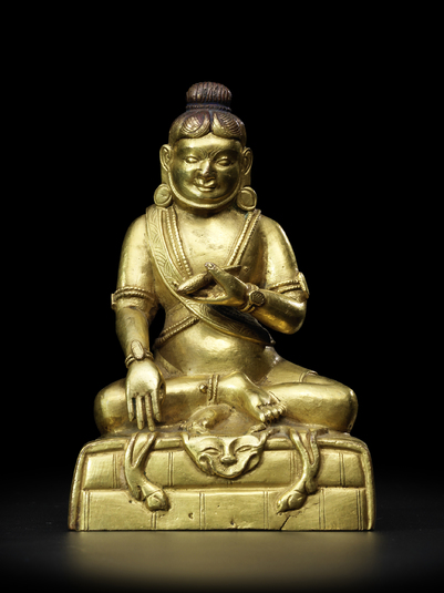 Mahasiddha Tilopa, Tibet, 18th c., gilt c.a., 12,5 cm, fish in hand, Bonhams